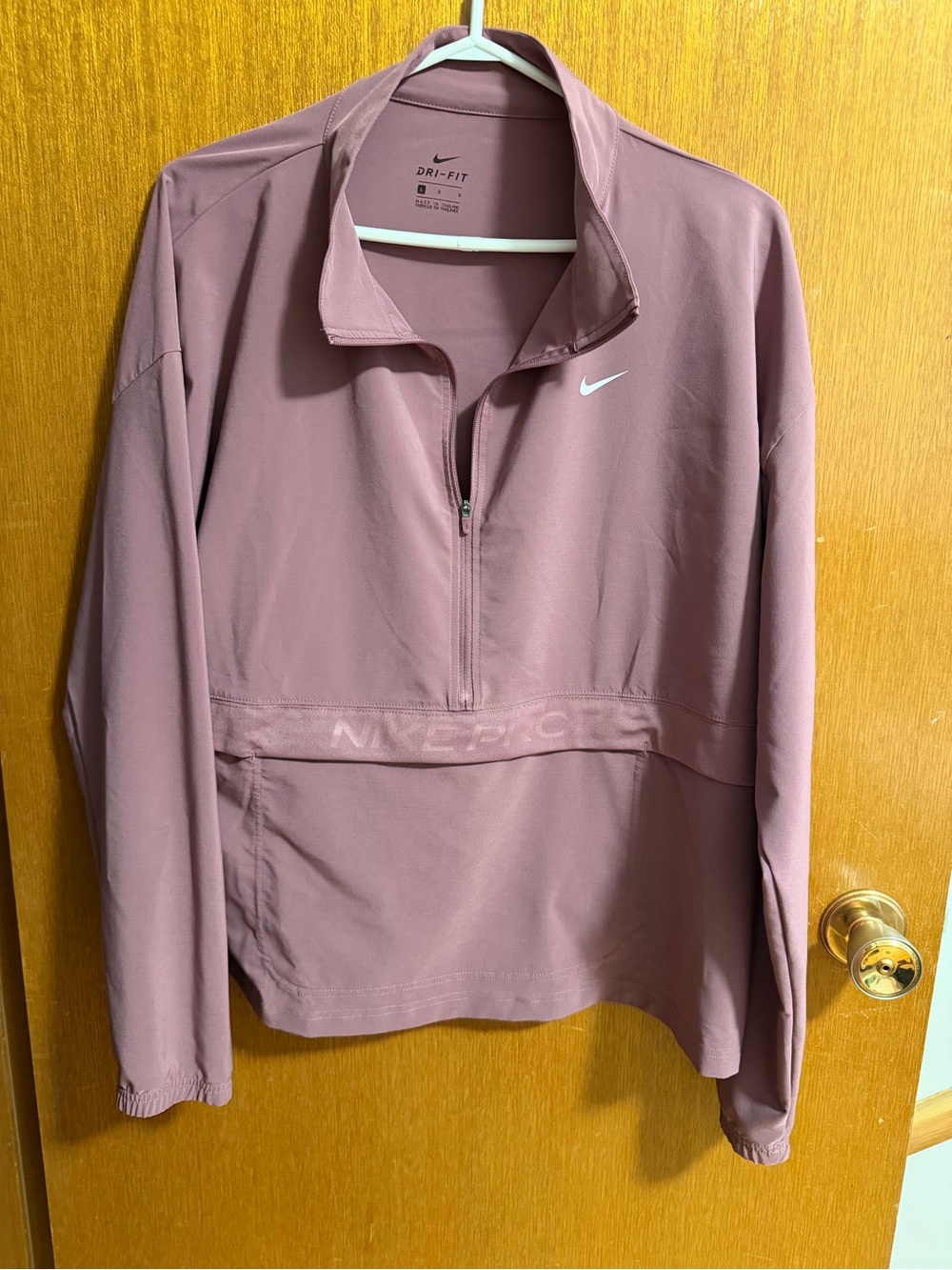 Nike Women’s Dri-FIT Half-Zip Pullover Jacket in Mauve